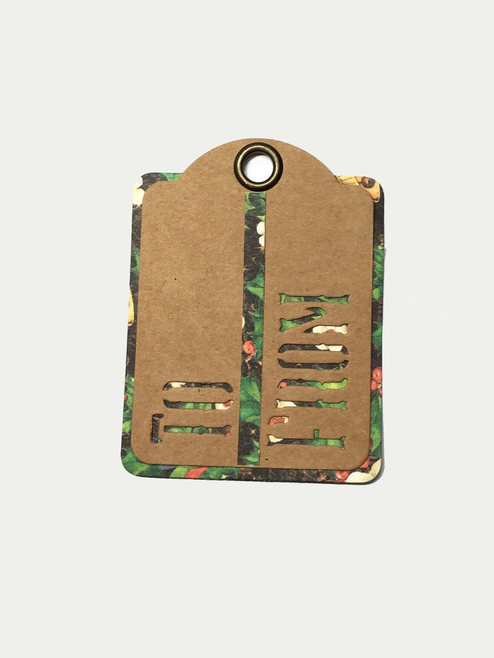 Adhere the tag to the paper and flip to the right side. Now glue a 1/4" x 3" strip of paper between the To and From words.