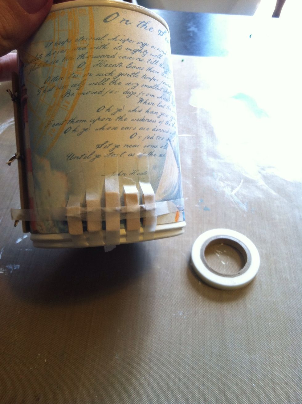Adhere the tiny bits of fence. I used washi tape to hold them in place until they dried.
