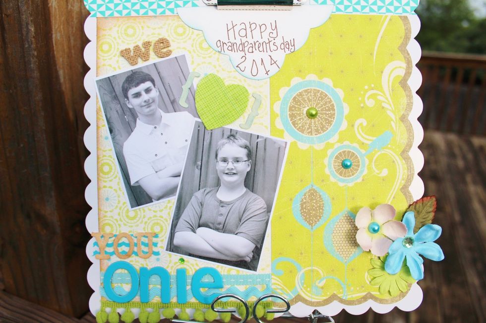 adhere the two cut printed paper pieces to clipboard leaving  border around outside edges and a thin space between the papers at the center. ink non-scalloped paper around edges using brown chalk ink.