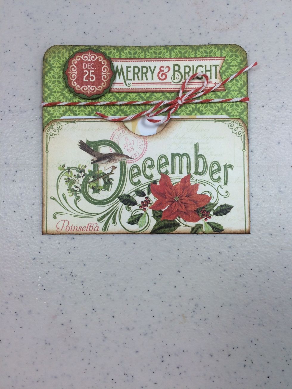 Adhere the two side flaps to create a pocket. Tie an 18" length of bakers twine around and into a bow. Insert a gift card or money into the pocket. Done!