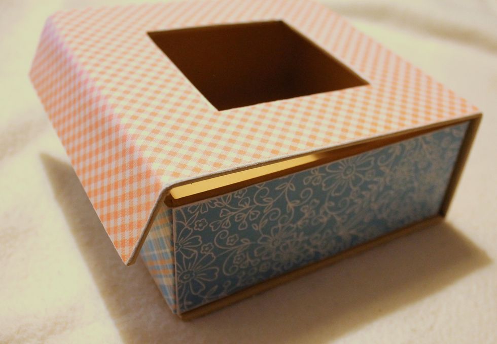 Adhere the two strips to the left and right side of the box.