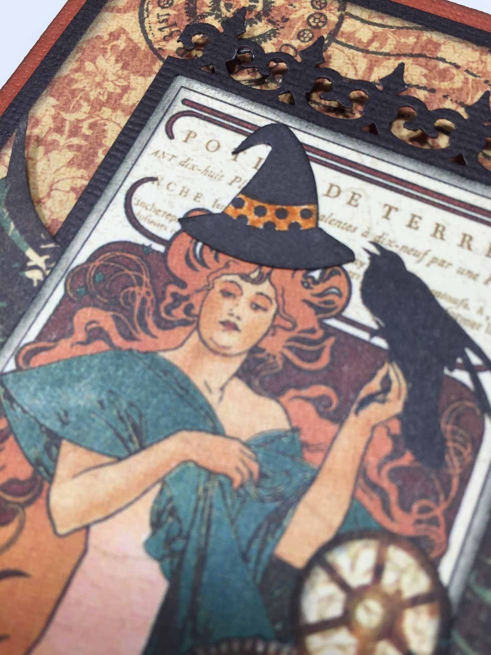 Adhere the witch's hat on the steampunk girl's head.