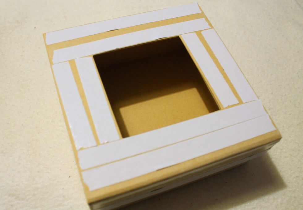 Adhere tissue tape onto the front side of the Graphic 45 Mixed Media box.