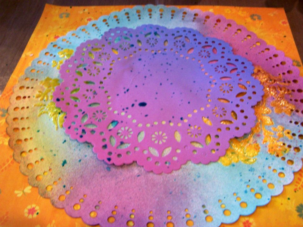Adhere to background paper.  Add splatters using Colorations Peacock Feathers and Minx Radiance.