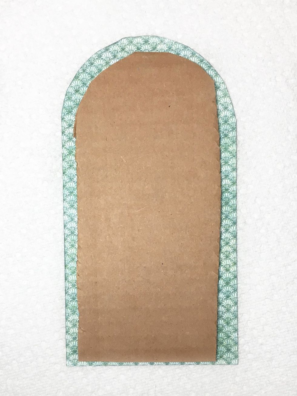 Adhere to the back of the arch.