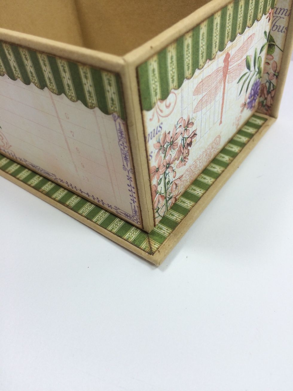 Adhere to the box's base, butting the strips like this.