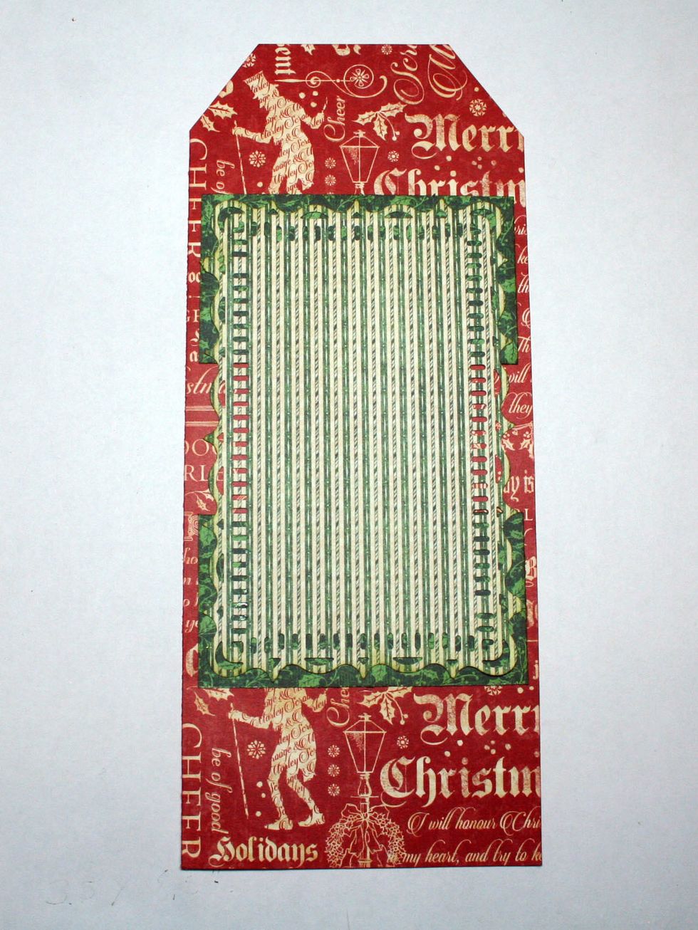Adhere to the tag as shown about 1.75" from the top.