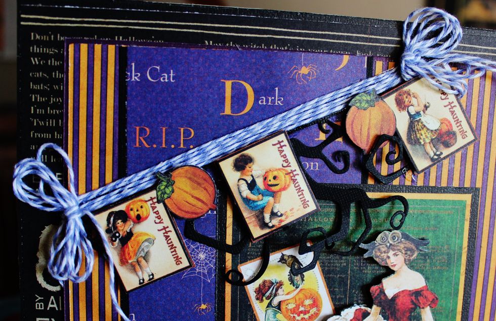 Adhere twisted edge black card stock to the top of prepared inside of box. to form a banner. Add twine along with fussy cut stamp images and pumpkins from pattern paper with pop dots.