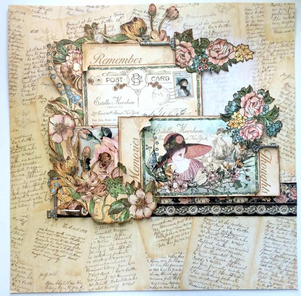 Adhere two floral bunches to the top right of the "remember" card. Adhere the third floral bunch partially overtop of the top right hand corner of the decorative card.