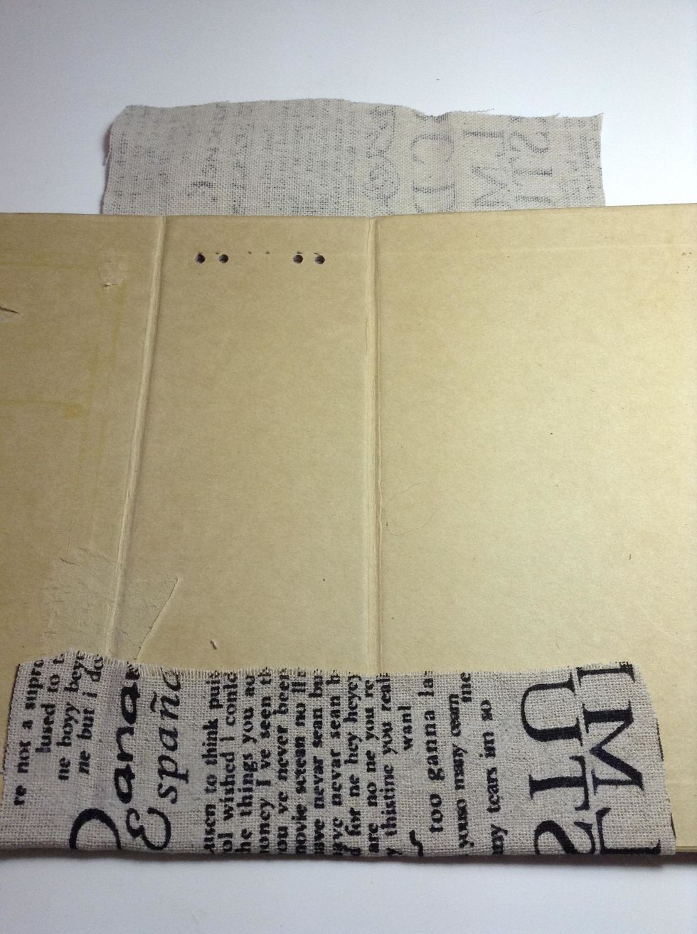 Adhere your piece of fabric  with glue and cover the spine front as shown.