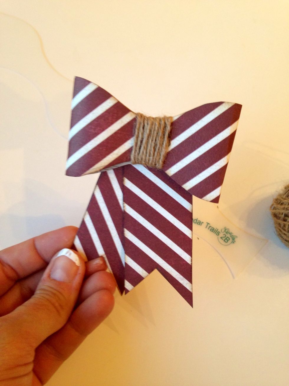 Adhere your tags and you have a bow. Super cute for a gift, card, or use it on your pages.