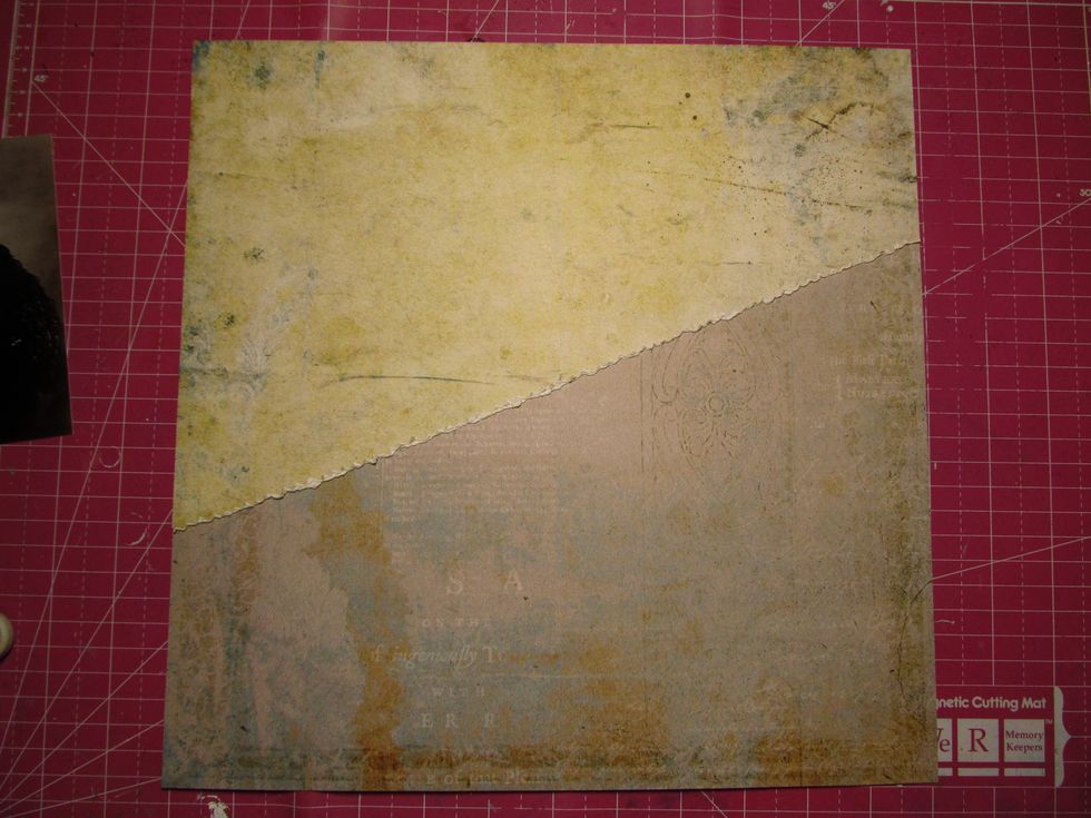 Adhere your torn sheet to your full sheet of paper. Don't glue your torn bottom completely down. We will be tucking some goodies under it.