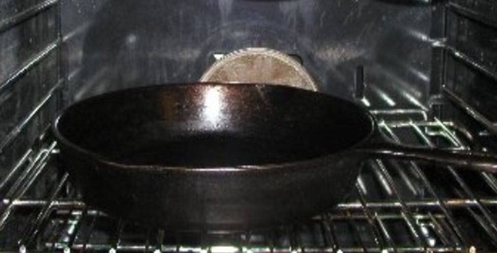 Adjust oven rack to middle position and preheat oven to 450\u00b0F. Brush the surface and sides of a large skillet (cast iron best) with oil. Put in the oven and heat 10 minutes, until oil is shimmering.