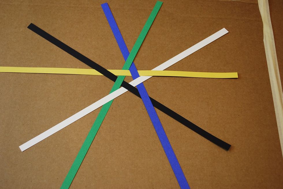 Adjust the strips so the star in the middle is tight as shown above. Try to keep equal lengths of strips on each side of the star.