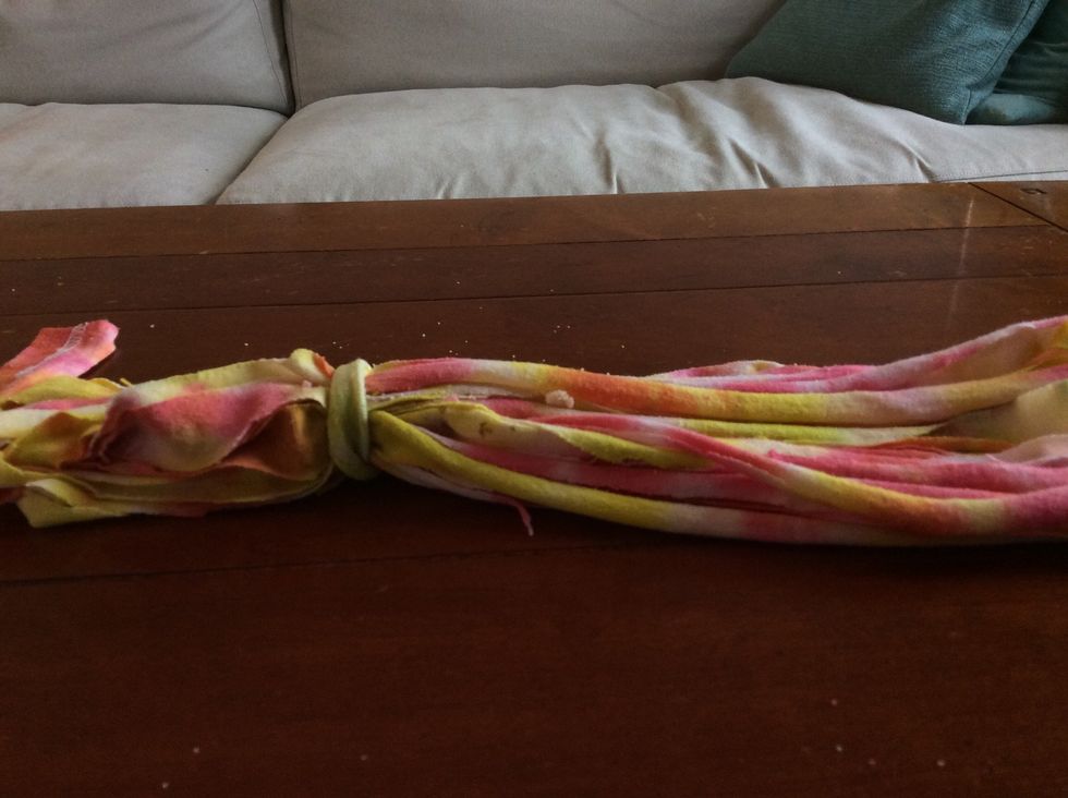 Adjust the tie's area around the loop, depending on how loose, or tight you want your scarf!