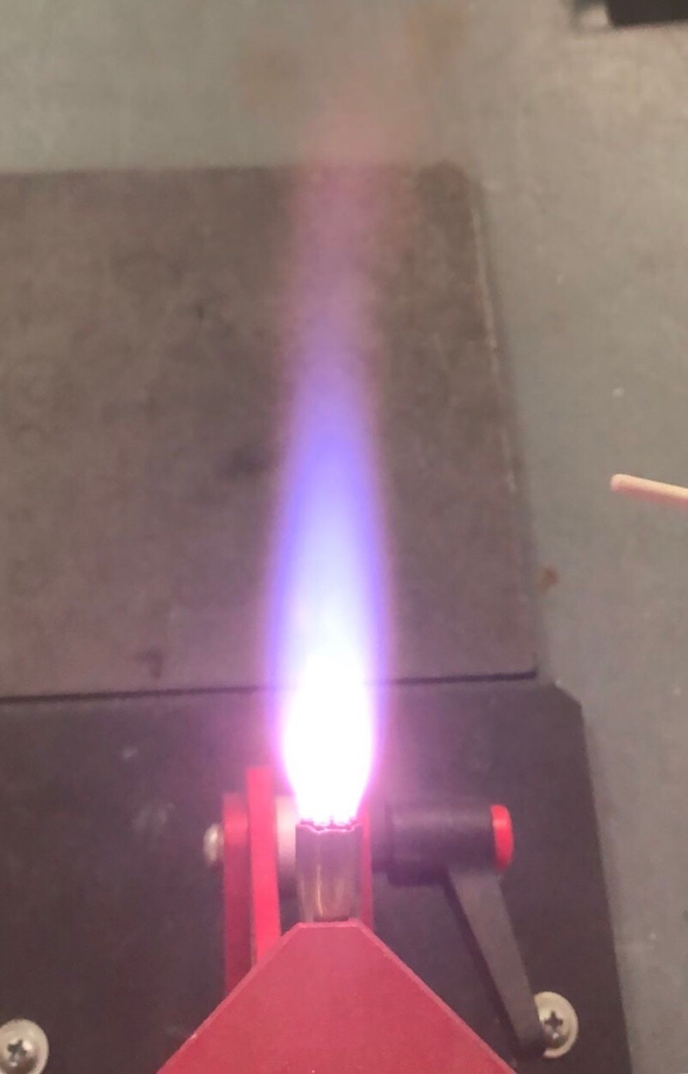 Adjust your torch to create a small brush reduction flame.