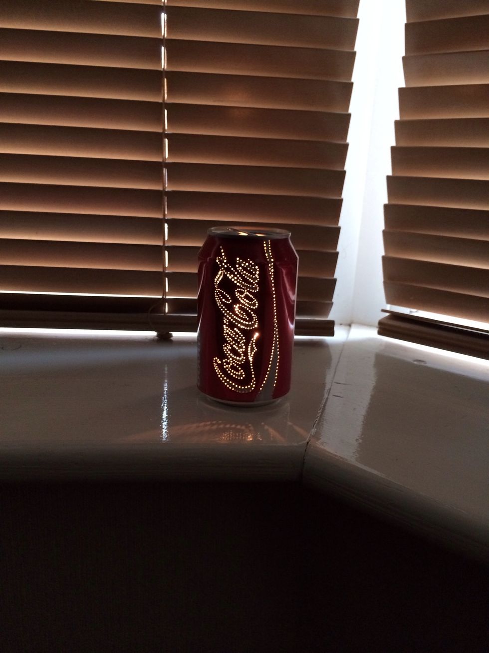 Admire your creation!    Please note, the can will get hot, be careful when handling it.   You can blow the candle out from the top of the can while it's lit and leave it to cool!!