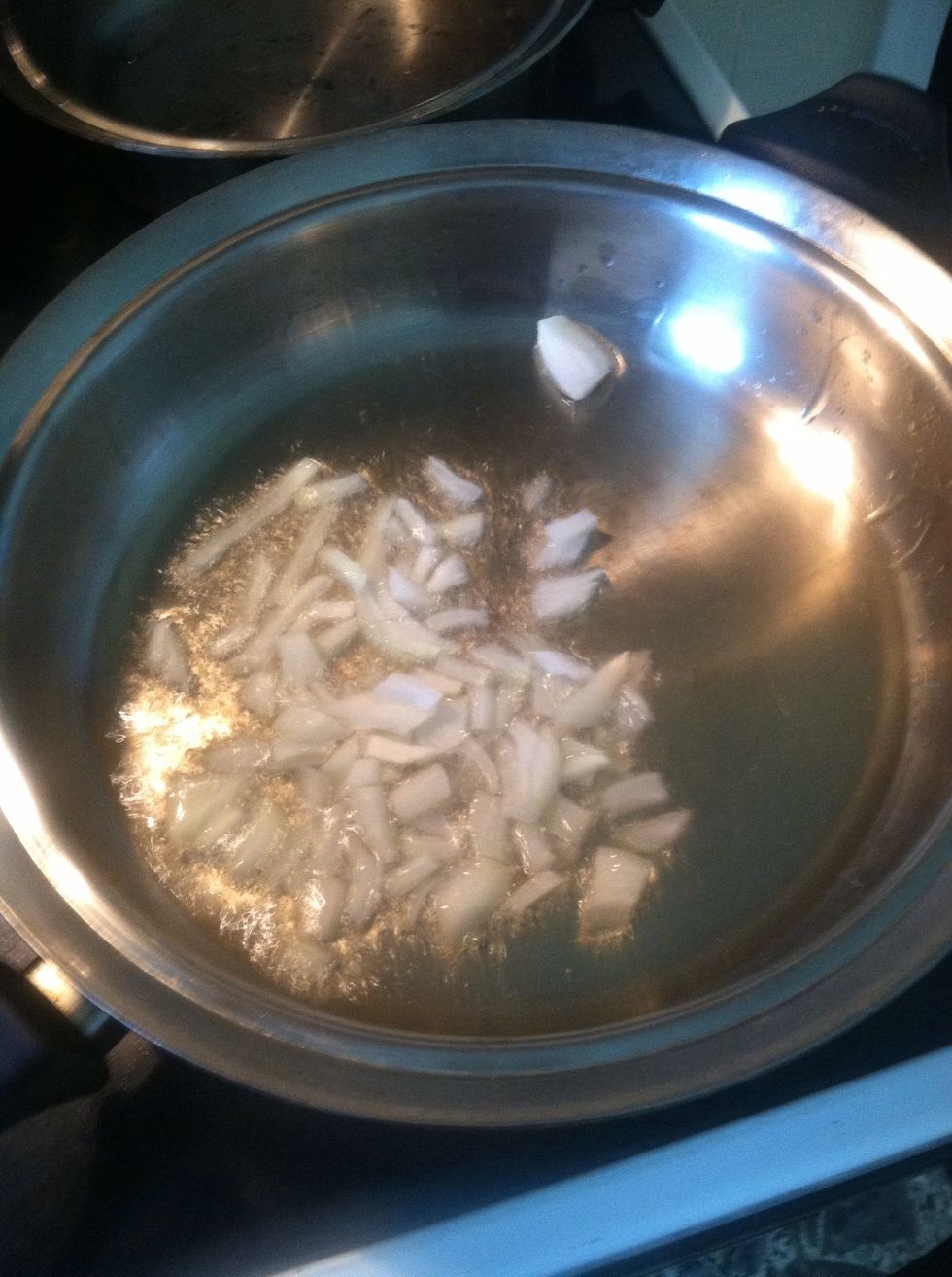 Ads chopped onion. Saut\u00e9 until clear glazed.