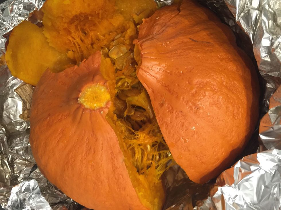 After 1:30 open the the pumpkin and with the help of a spoon scoop the flesh