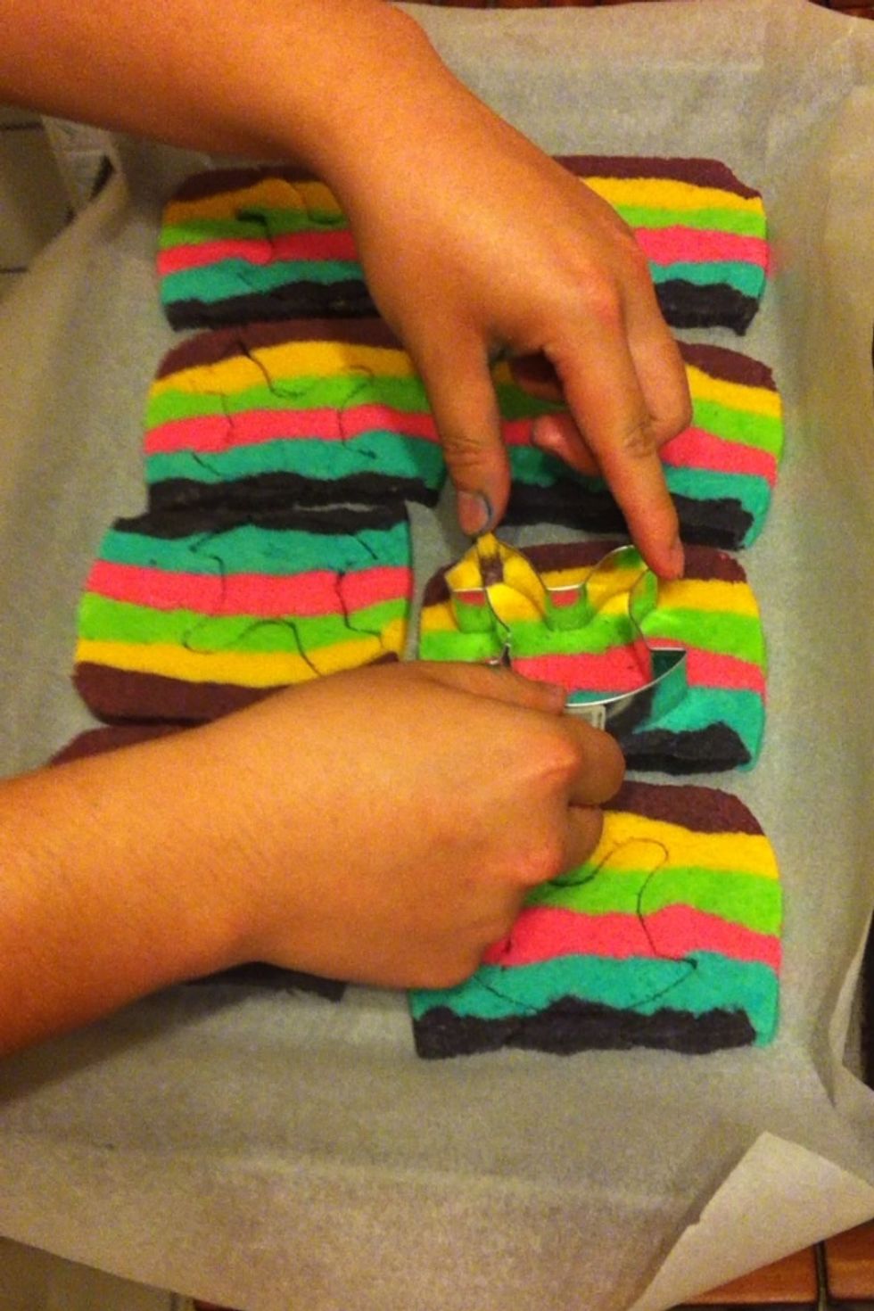 After 10-12 minutes, the cookies will be baked and have risen but are still soft - don't worry, they are DONE. While they are still hot and soft, use your cookie cutter to cut out your cookies