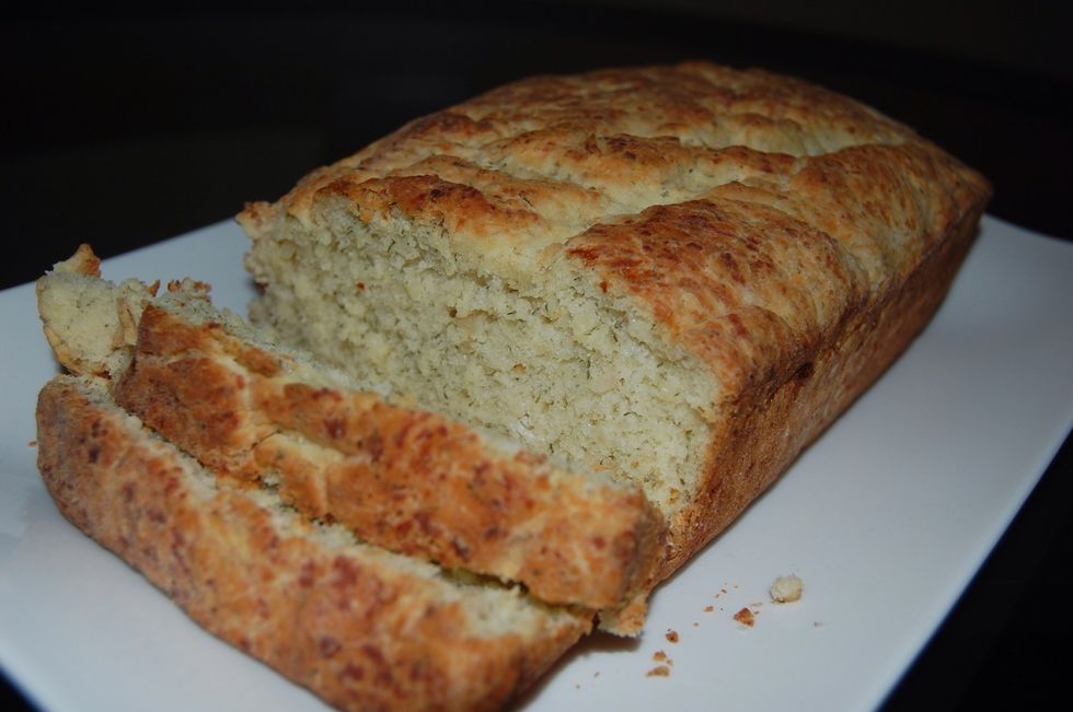After 10-15 minutes, remove from loaf pan. It should be ready to cut, butter and serve! It is great as a dinner side or just by itself!