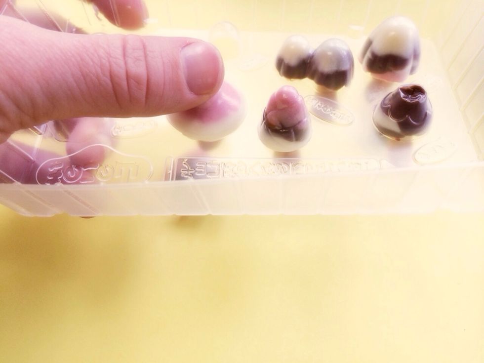 After 10 or so minutes In Refrigerator , remove and turn mold over-If they are hardened enough, they will pop out very easily,