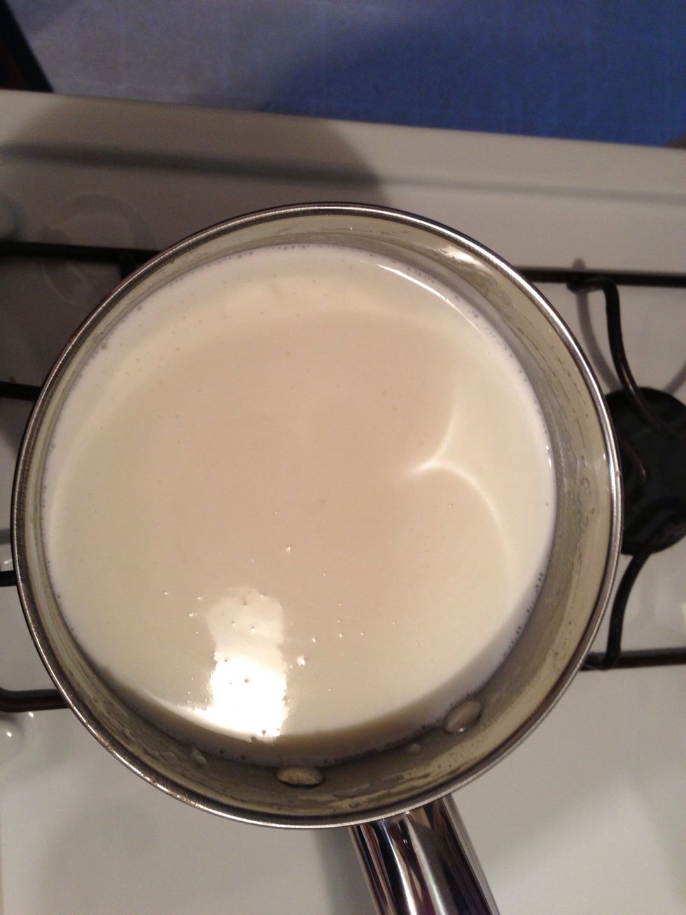 After 15-20 minutes, the mixture will begin to thicken enough to coat the back of a spoon.