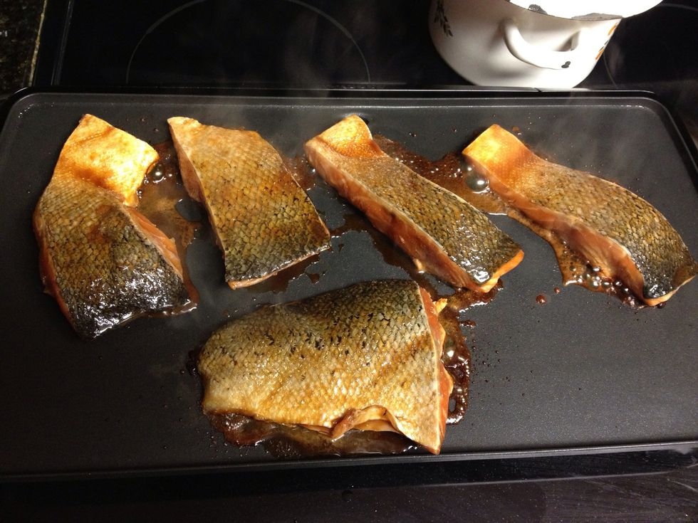 After 15 min begin cooking your salmon. I grilled it at 350 degrees on a griddle, you can also cook on the grill, or oven. Cook 6-7 min skin side up if you like your skin to be crispy. Then flip..