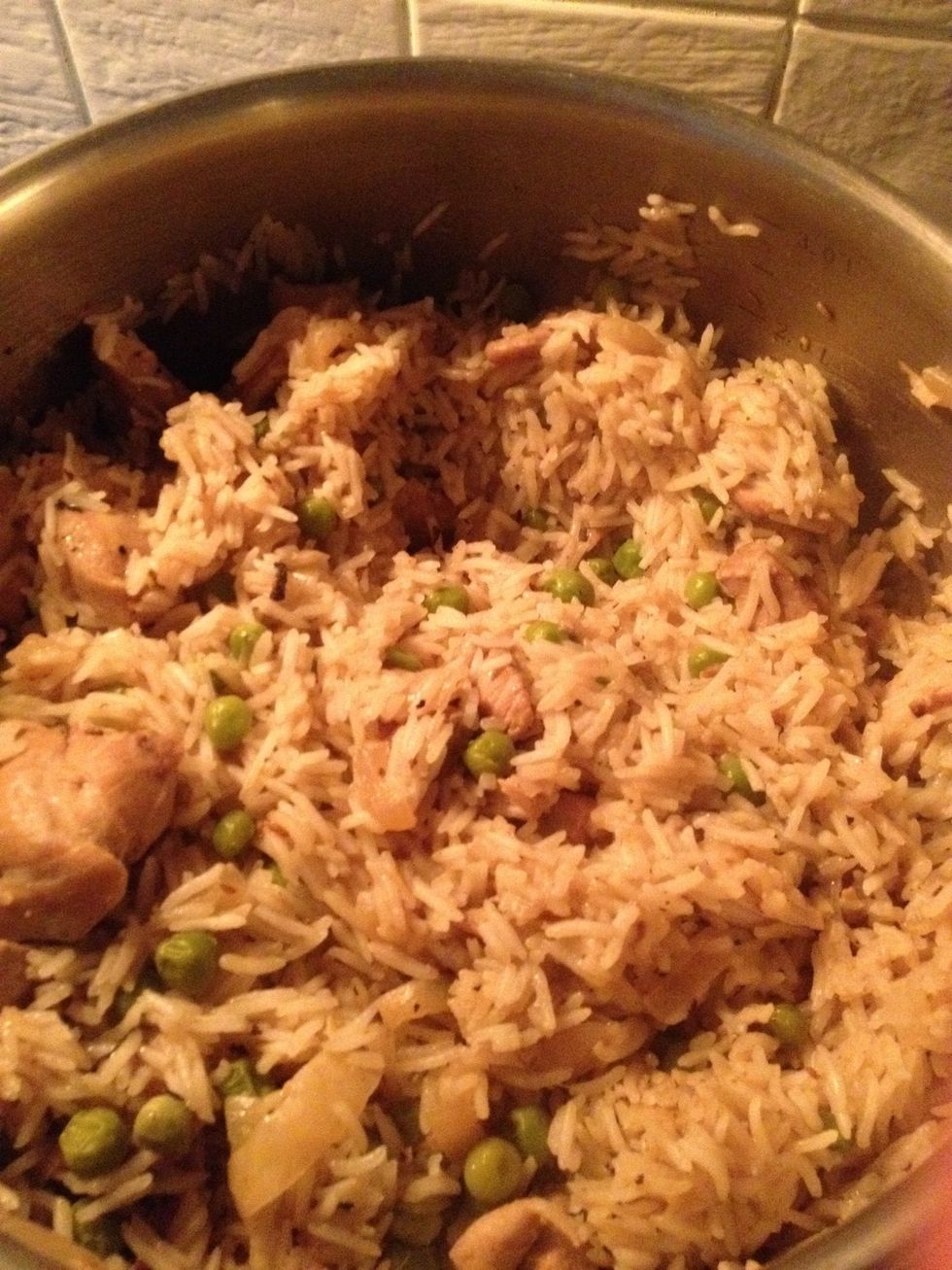 after 15 mins it should look like this, have a stir to ensure it doesn't stick to the bottom of the pan. it's not necessarily fully cooked, you need to do the next stage to avoid mushy rice.