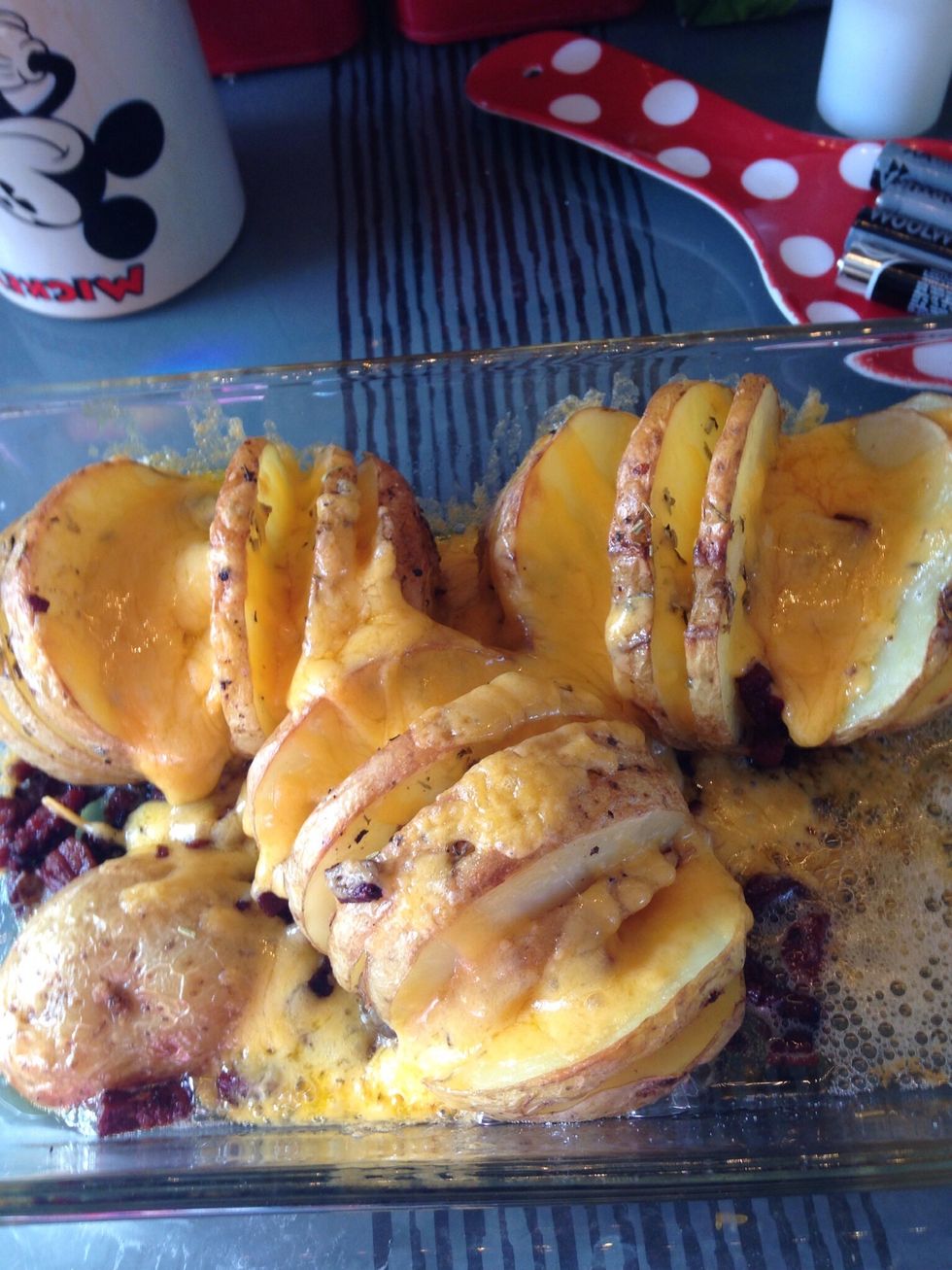 After 15 mins remove again and sprinkle cheese over, season, return to oven and wait till cheese is melted