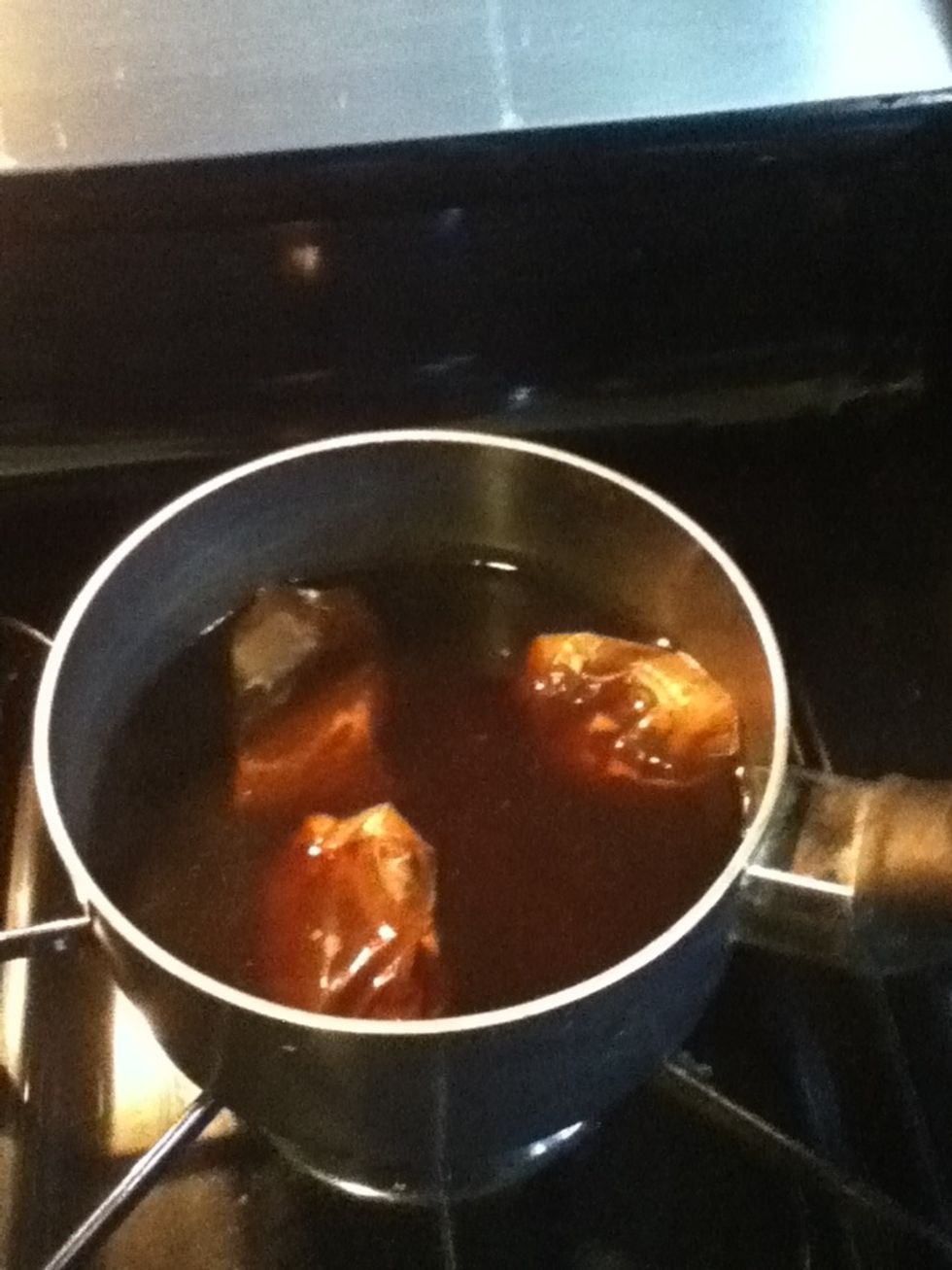 After 15 to 20 min your water should be dark and filled with all the yummy goodness ^_^ you may remove your tea bags with a spoon, be careful the water is HOT. Dont forget to turn your burner off!!