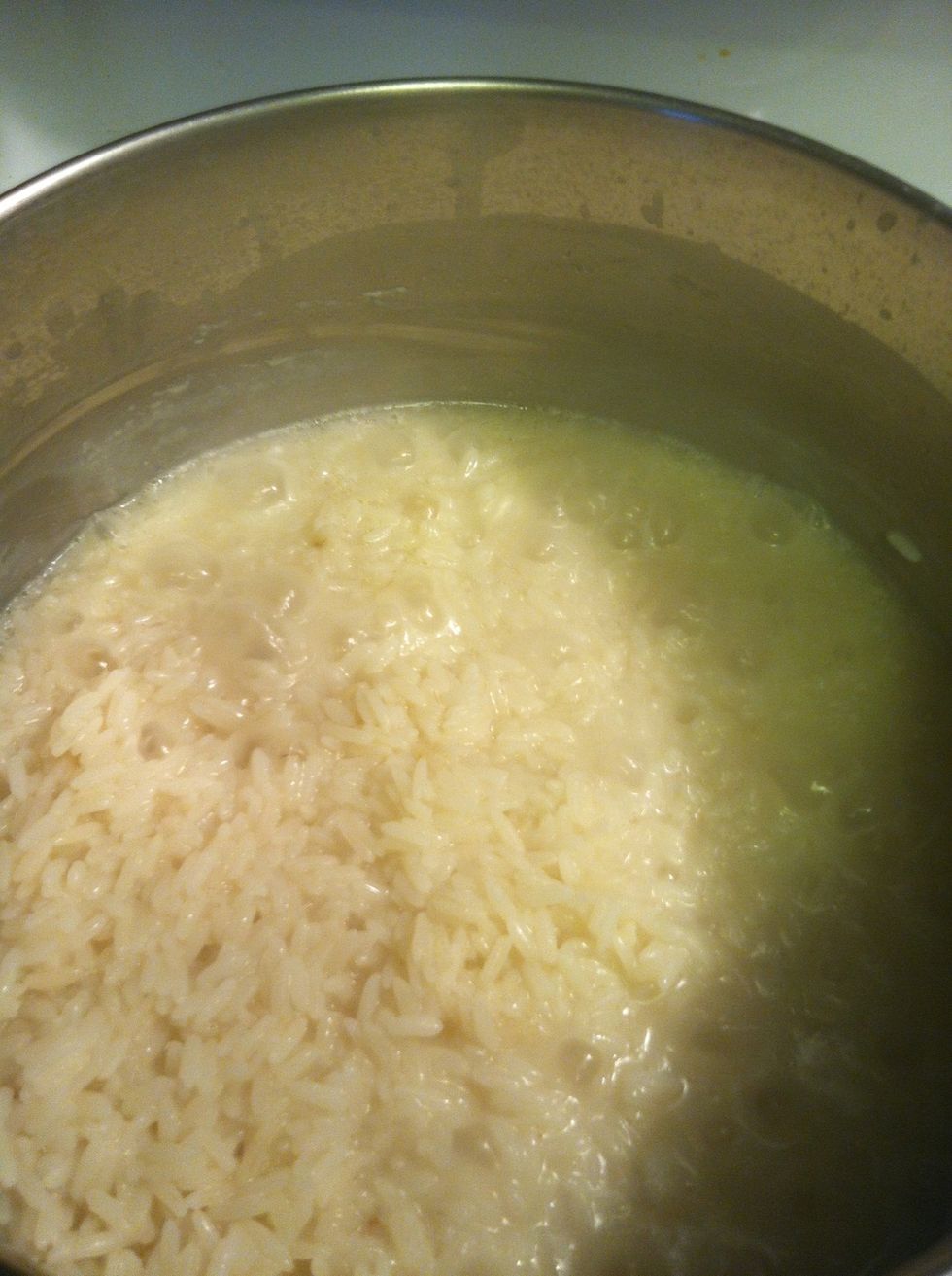 After 2-3 minutes of boiling The rice becomes visible to the surface (like the left side)