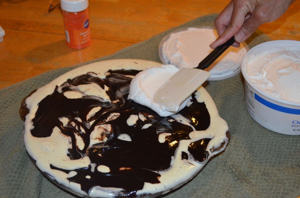 After 2-4 hours, take your cool whip and put it on top of the hot fudge