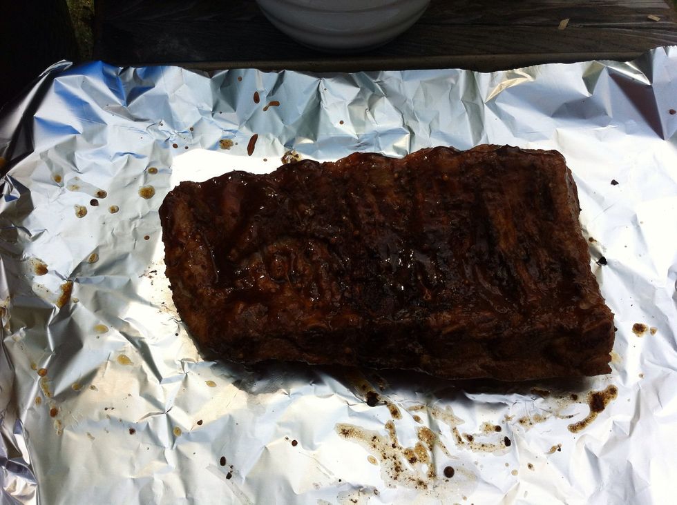After 2 hours of cooking Turn ribs over and brush some BBQ Sauce onto them (recipe for BBQ sauce to come in separate guide) on one side only. Place back on grill, temp 250-275 for next hour.
