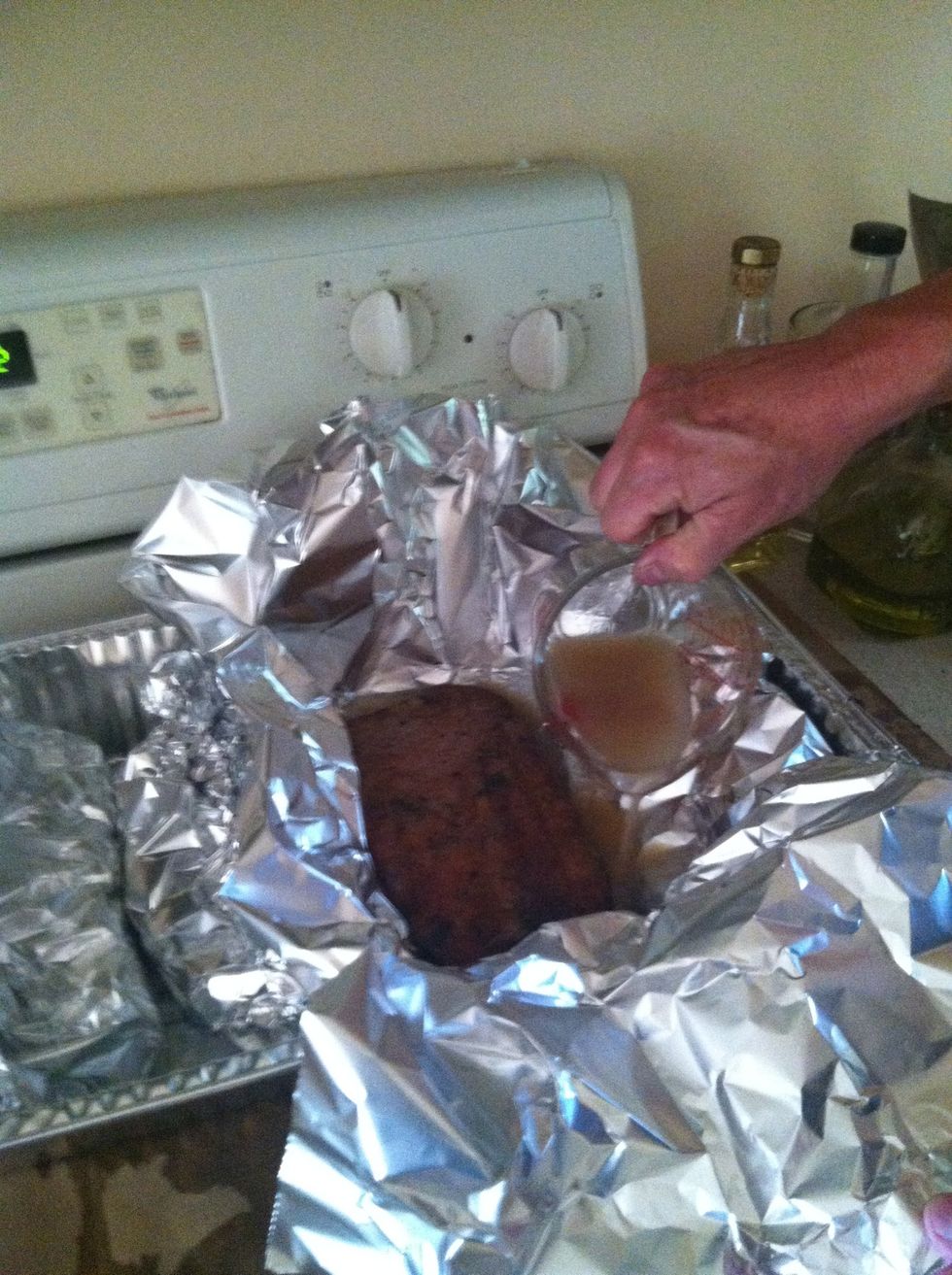 After 2 hours, place ribs in a "Texas Crutch" (aka, an aluminum tent).  Add the remaining brine and return to the indirect heat side of grill for another 1 hour.