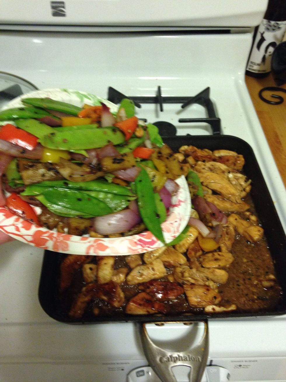 After 2 minutes, add the veggies back into the pan.