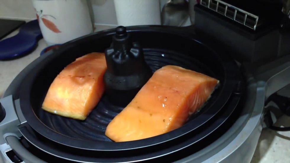 After 20 minutes of the salmon being inside the ziplock bag, take it out and out it on the tray ready for cooking.