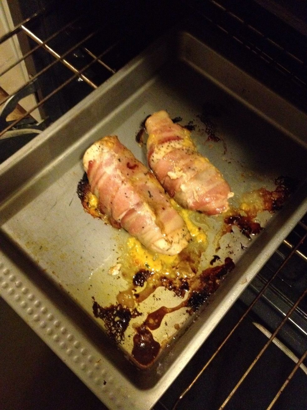After 20 minutes, turn the chicken to another side and continue bake for 15 minutes more. Some of the cheese is going to ooze out. If you lined your baking sheet, it will be an easy cleanup.