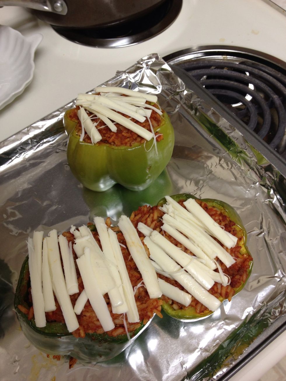 After 25 minutes top with shredded mozzarella cheese (I was out so I used string cheese) and bake for 5 more minutes, or until cheese is melted.