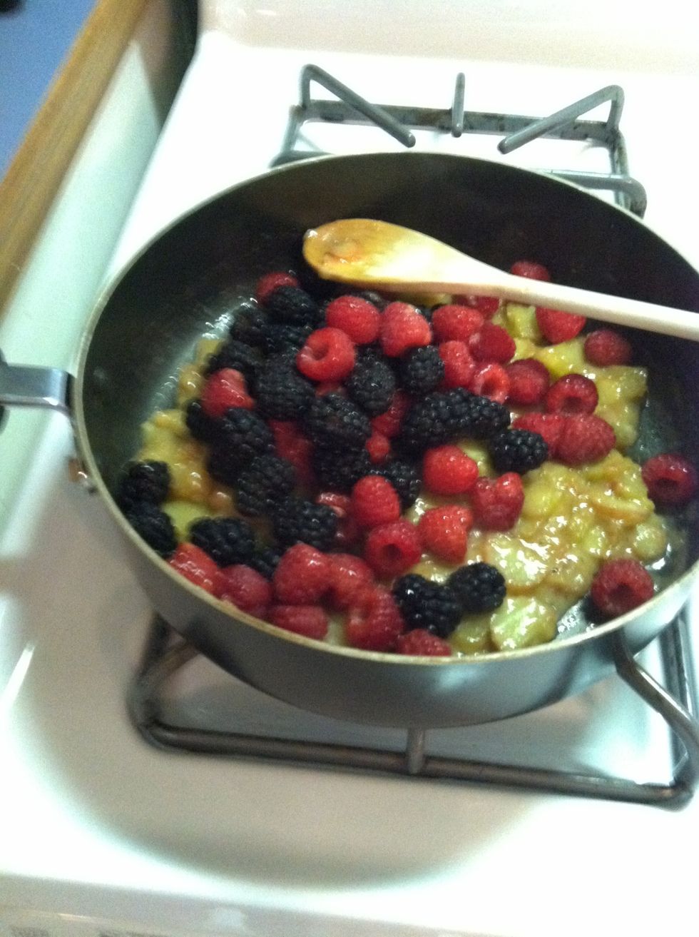 After 3-4 minutes, add berries. Continue at medium heat for another 3-4 minutes Stir frequently. Some of the raspberries will cook down.