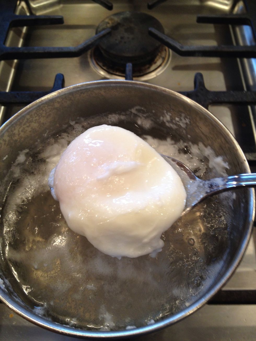 After 3-4 minutes, the white will be firm-looking. Remove it with a slotted spoon.