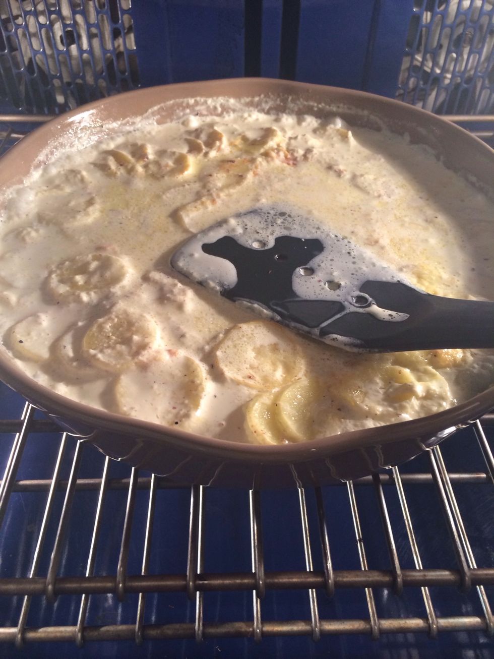 After 30 mins press the potatoes so as the liquid comes up to the surface to cover the potatoes