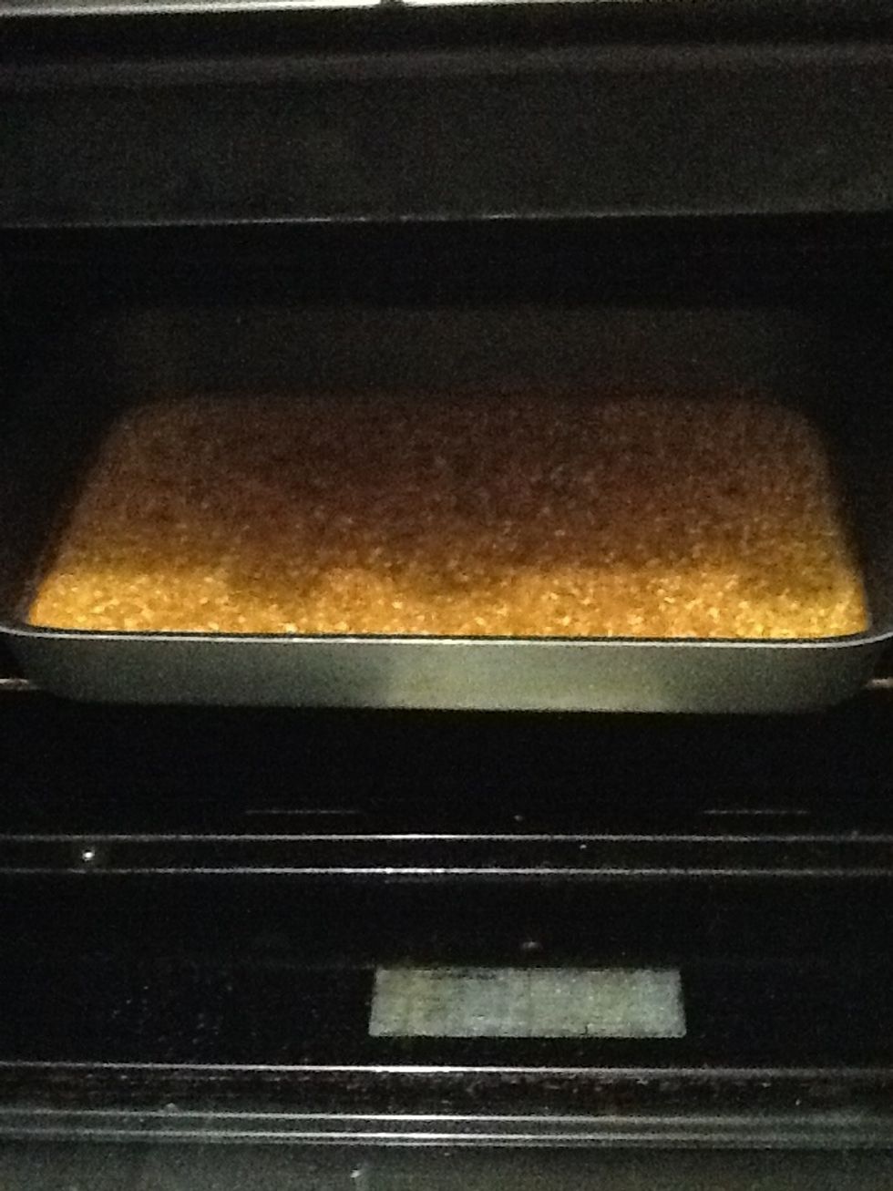 After 30 minute remove the plate from the oven and distribute the sheera on the basbosa to make it more flavor.