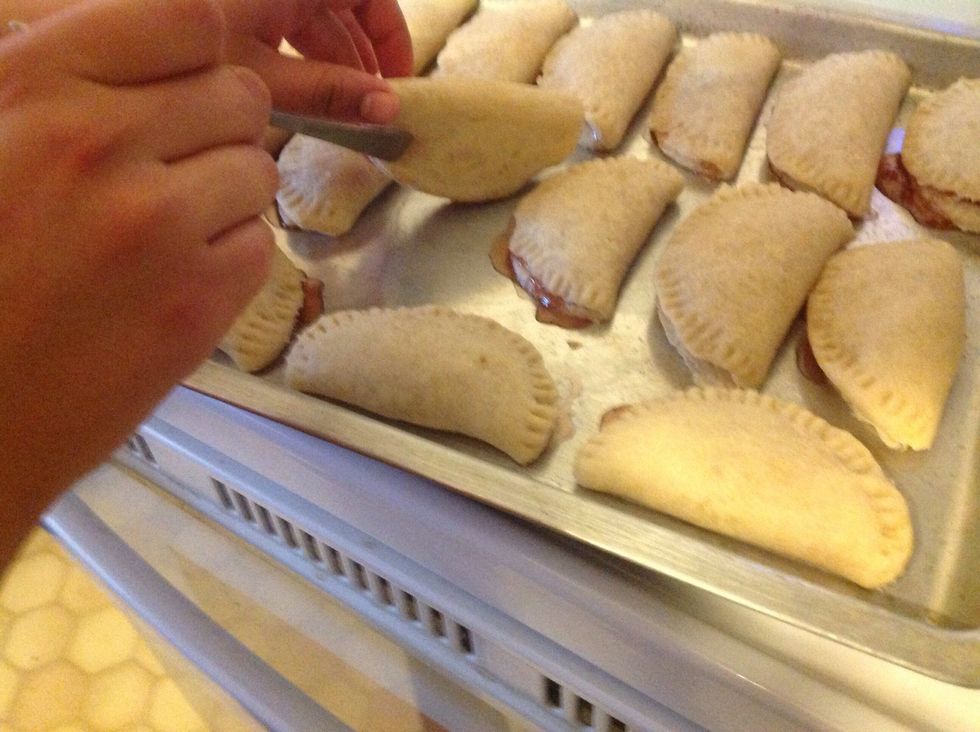 After 30 minutes check the empanadas and if the bottom of the empanada is brown flip the empanadas and put them back in the oven for 5 more minutes.