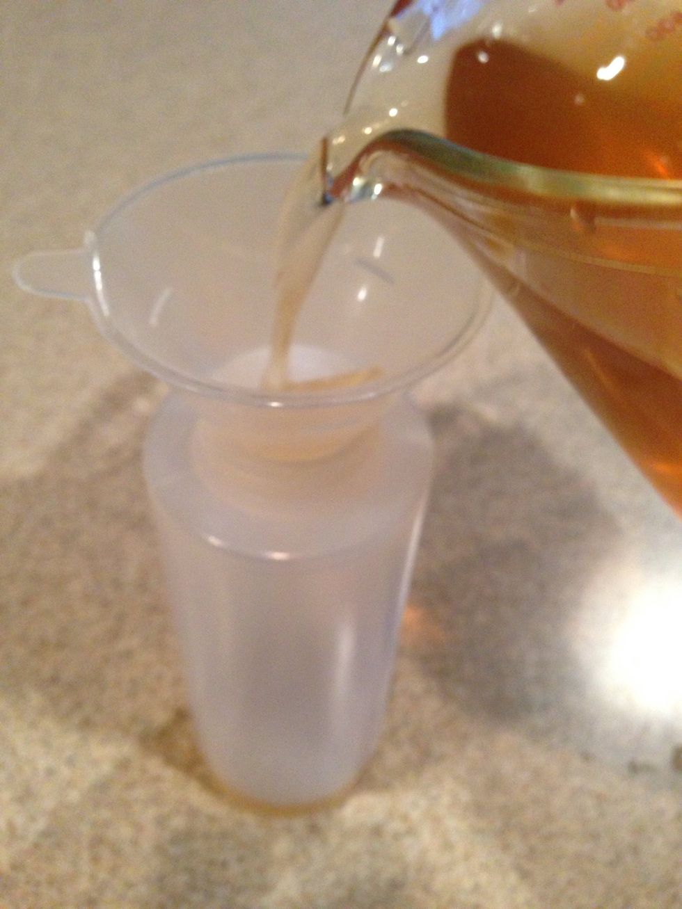 After 30 minutes, pour into a container.  This one works best to easily use on your hair.