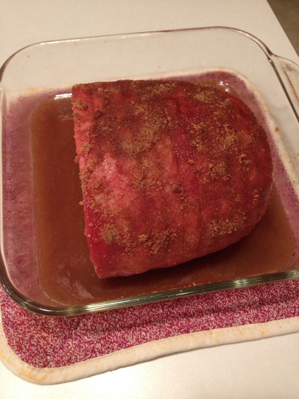 After 30 minutes, remove ham from oven.  In a small bowl, mix 1/3 c. brown sugar and 1/4 tsp. cinnamon.  Rub this onto the top of the ham.