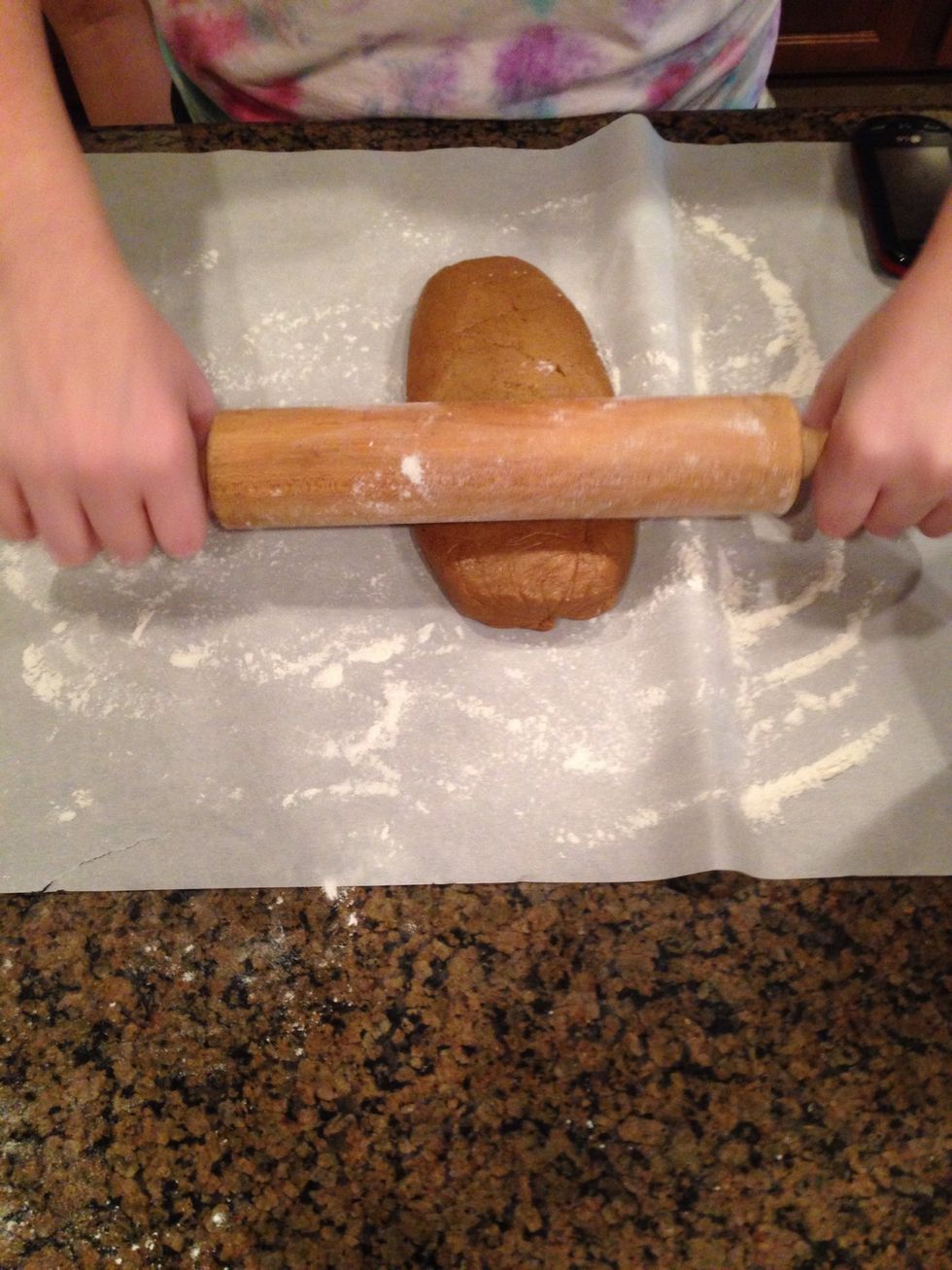 After 30 minutes take out the dough and roll out the dough. Preheat oven to 350 degrees now.