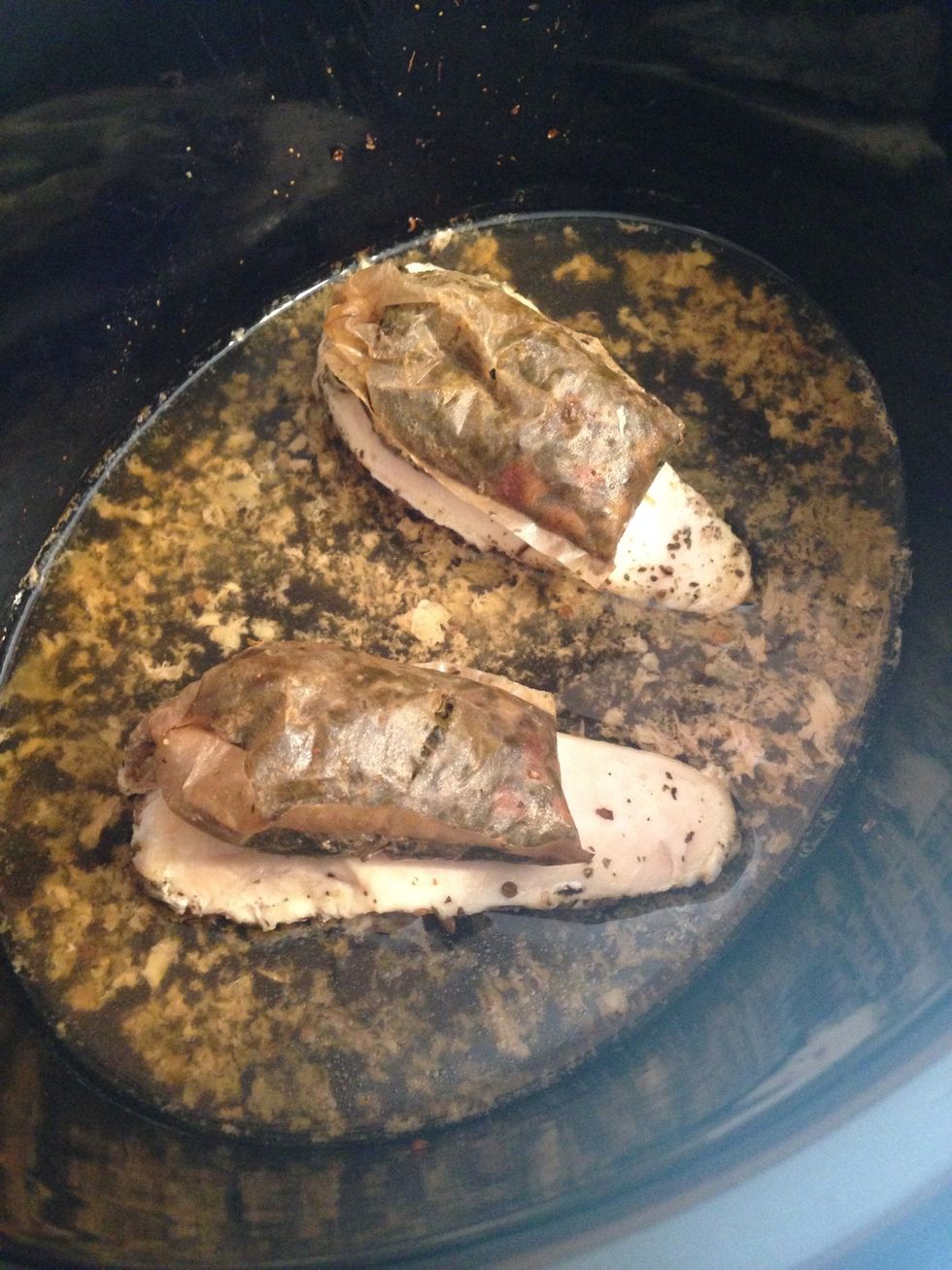 After 4 hours in the crockpot, move the tea bags to sit on top of the chicken breasts and continue cooking.
