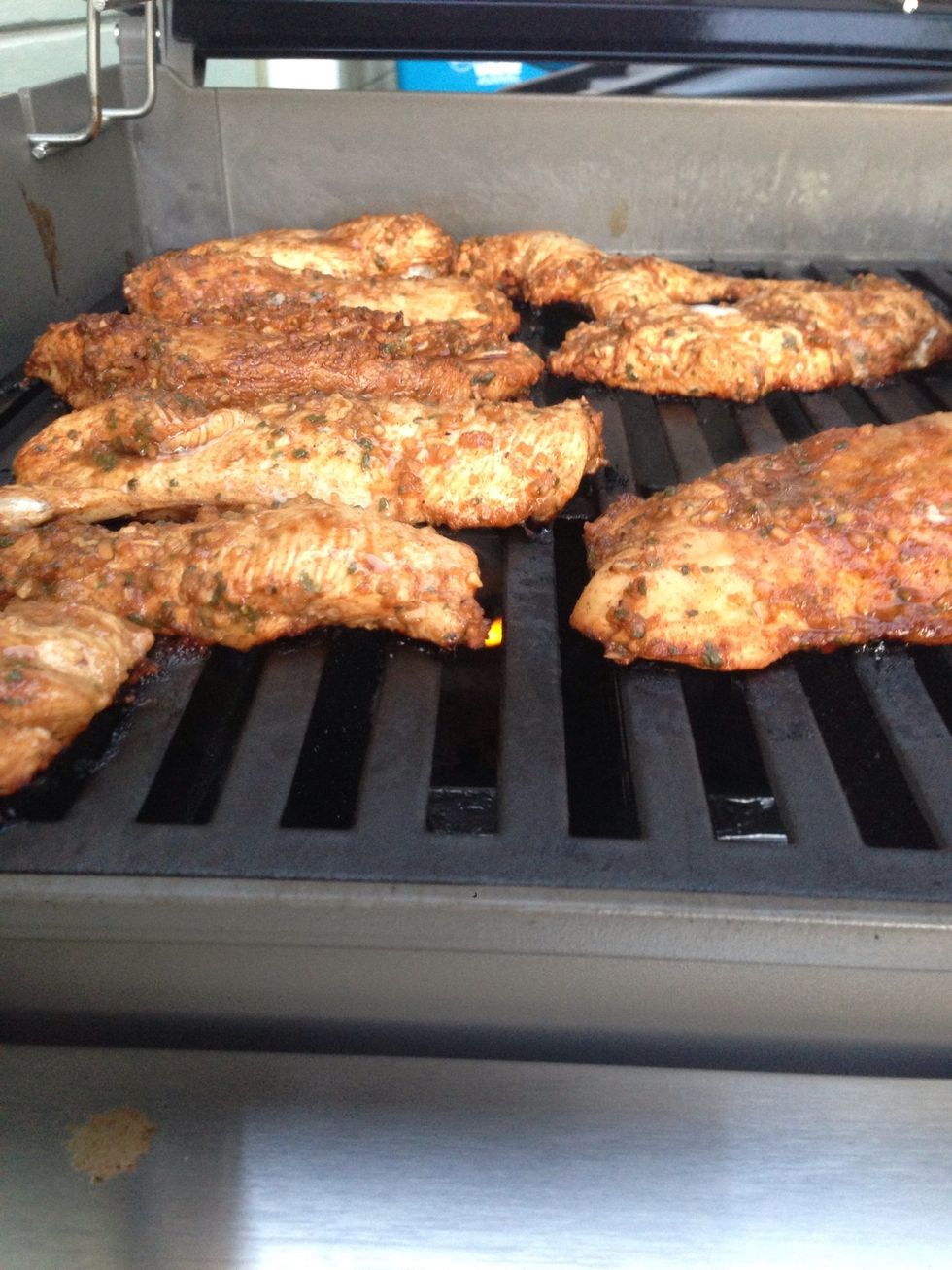 After 4 mins, flip the chicken and cover the grill. You can tell when it's ready because the edges are white. After 4 mins, the chicken is ready to be removed.