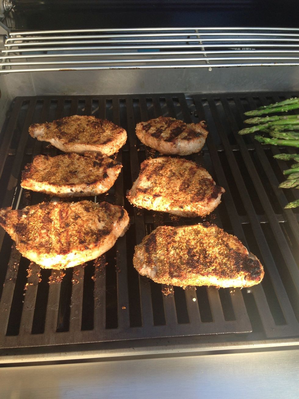 After 4 minutes, turn the pork over. You can tell when it's ready because the edges turn white. Turn the heat down to med-high and cook for 5 mins.